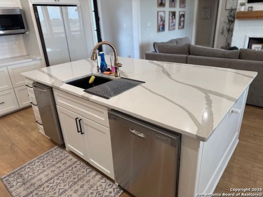 Fireplace, Interior, Kitchen, Stainless Steel Appliances, Wood Texture Flooring