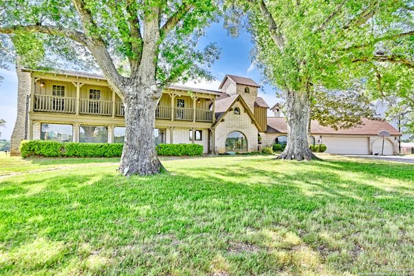 Attached, Backyard, Detached Garage, Exterior, Facade, Brick Facade, Tudor Revival