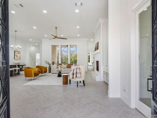 Chandelier, Dining room, Fireplace, Interior, Living room, Recessed Lighting, Wood Texture Flooring
