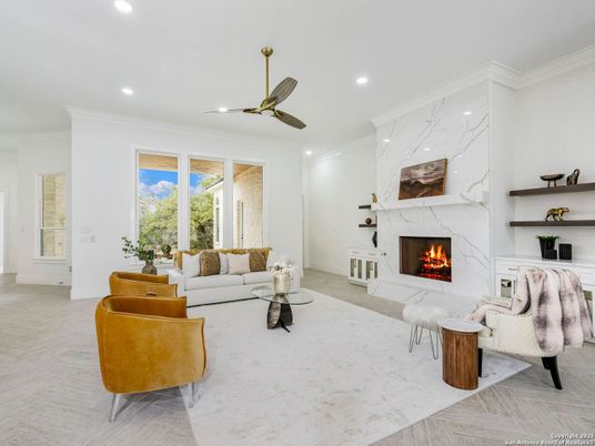 Fireplace, Interior, Living room, Marble Walls, Recessed Lighting, Wood Texture Flooring