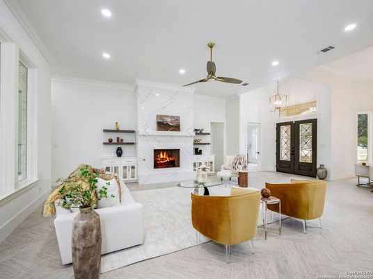 Fireplace, Interior, Living room, Marble Walls, Pendant Lights, Recessed Lighting, Wood Texture Flooring