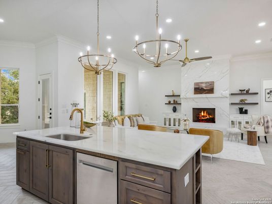 Chandelier, Dining room, Fireplace, Interior, Kitchen, Living room, Marble, Pendant Lights, Recessed Lighting, Stainless Steel Appliances, Wood Texture Flooring
