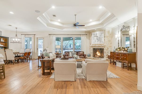 Dining room, Fireplace, Interior, Living room, Pendant Lights, Recessed Lighting, Wood Texture Flooring