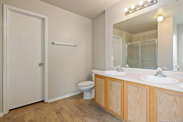 Bathroom, Dual Sink Vanities, Glass Shower, Interior, Wood Texture Flooring