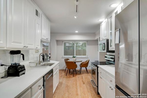 Dining room, Interior, Kitchen, Recessed Lighting, Stainless Steel Appliances, Wood Texture Flooring