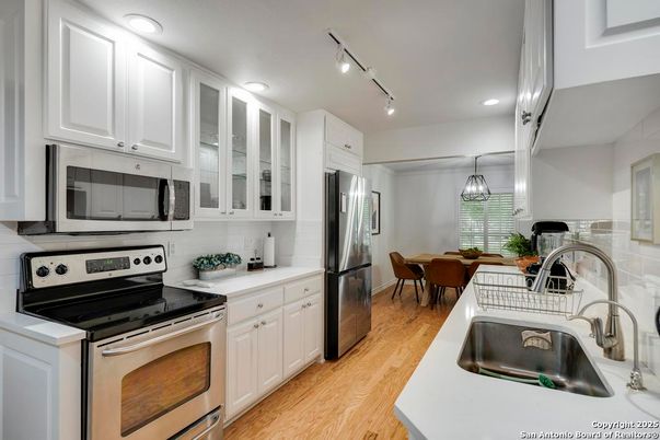 Dining room, Interior, Kitchen, Recessed Lighting, Stainless Steel Appliances, Wood Texture Flooring