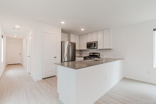 Interior, Kitchen, Recessed Lighting, Stainless Steel Appliances, Wood Texture Flooring