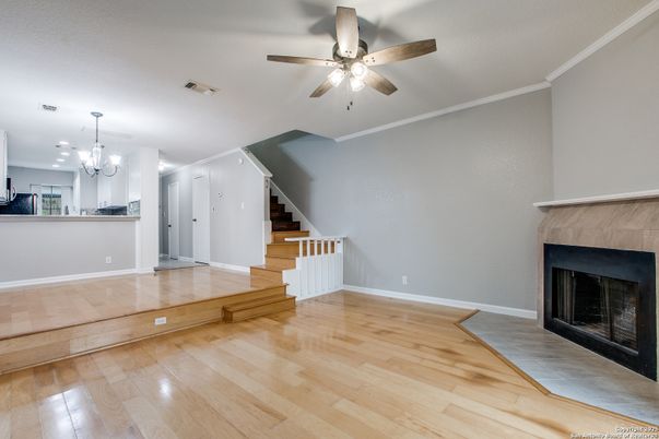 Chandelier, Empty room, Fireplace, Interior, Kitchen, Pendant Lights, Wood Texture Flooring