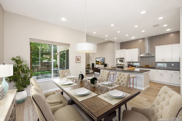 Dining room, Interior, Kitchen, Pendant Lights, Recessed Lighting, Stainless Steel Appliances, Wood Texture Flooring