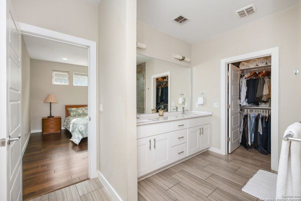 Bathroom, Dual Sink Vanities, Interior, Recessed Lighting, Walk-in Closets, Wood Texture Flooring