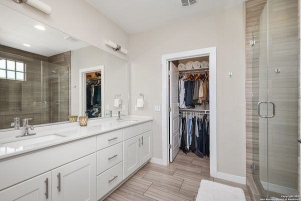 Bathroom, Dual Sink Vanities, Glass Shower, Interior, Recessed Lighting, Walk-in Closets, Wood Texture Flooring