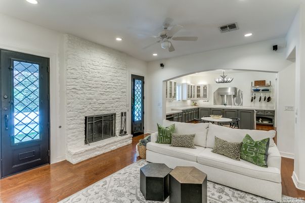 Chandelier, Fireplace, Interior, Kitchen, Living room, Recessed Lighting, Stone Walls, Wood Texture Flooring