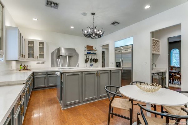 Chandelier, Dining room, Interior, Kitchen, Pendant Lights, Recessed Lighting, Stainless Steel Appliances, Wood Texture Flooring