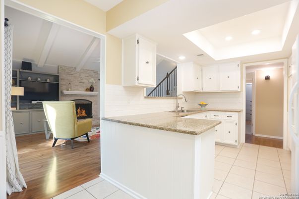 Fireplace, Interior, Kitchen, Recessed Lighting, Stone Walls, Wood Texture Flooring