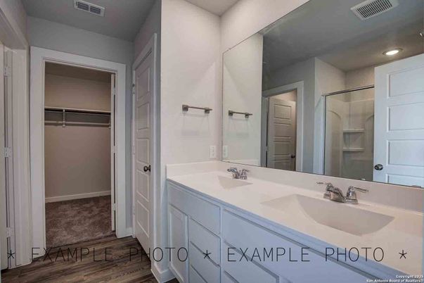 Bathroom, Dual Sink Vanities, Interior, Recessed Lighting, Walk-in Closets, Wood Texture Flooring