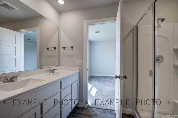 Bathroom, Dual Sink Vanities, Glass Shower, Interior, Recessed Lighting, Wood Texture Flooring