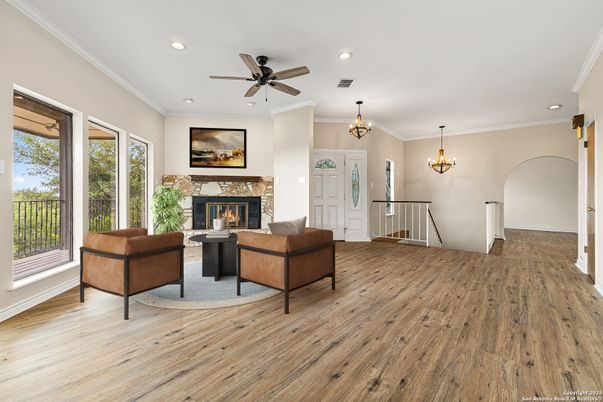 Chandelier, Fireplace, Interior, Living room, Recessed Lighting, Wood Texture Flooring