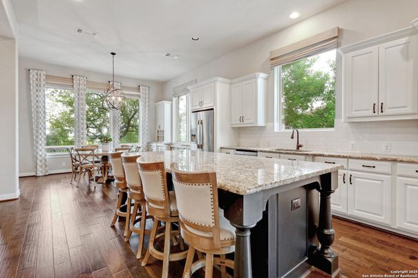 Dining room, Interior, Kitchen, Pendant Lights, Recessed Lighting, Stainless Steel Appliances, Wood Texture Flooring