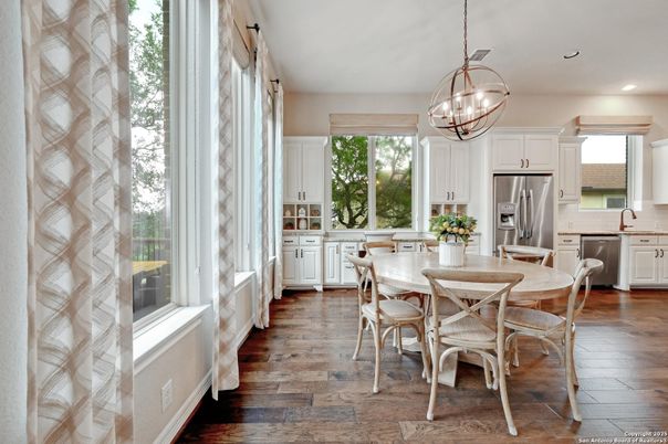 Chandelier, Dining room, Interior, Kitchen, Pendant Lights, Recessed Lighting, Stainless Steel Appliances, Wood Texture Flooring