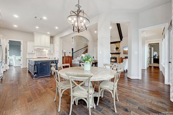 Chandelier, Dining room, Fireplace, Interior, Kitchen, Pendant Lights, Recessed Lighting, Wood Texture Flooring