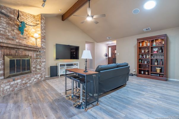 Fireplace, Home Office, Interior, Living room, Recessed Lighting, Stone Walls, Wooden Beams, Wood Texture Flooring