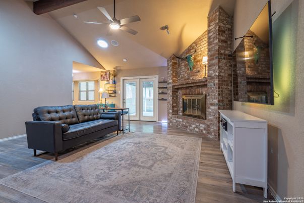 Fireplace, Interior, Living room, Recessed Lighting, Stone Walls, Wooden Beams, Wood Texture Flooring