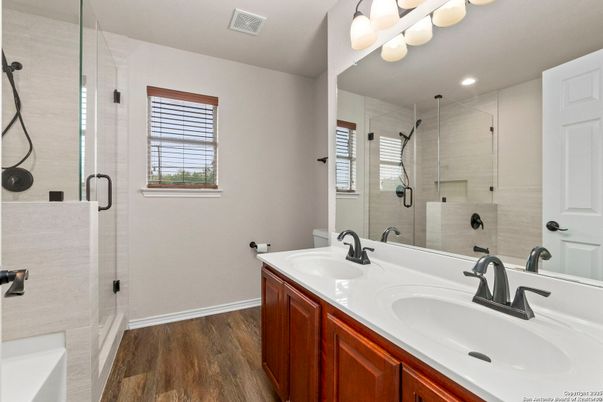 Bathroom, Dual Sink Vanities, Glass Shower, Interior, Recessed Lighting, Wood Texture Flooring