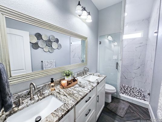 Bathroom, Dual Sink Vanities, Glass Shower, Interior, Marble Walls, Recessed Lighting