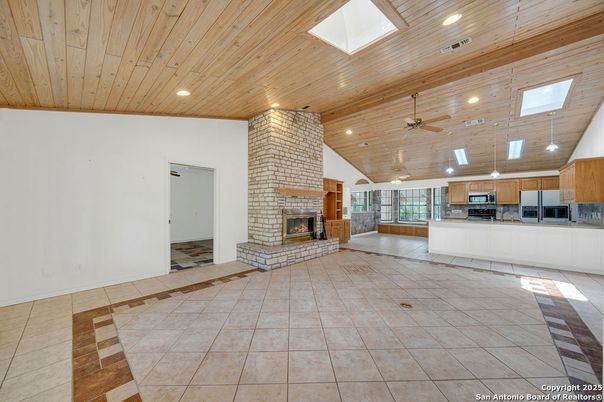 Empty room, Fireplace, Interior, Kitchen, Pendant Lights, Recessed Lighting, Wooden Ceilings