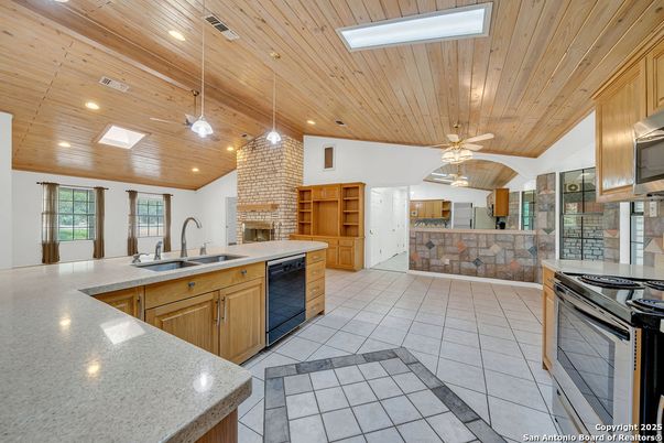 Fireplace, Interior, Kitchen, Pendant Lights, Recessed Lighting, Stone Walls, Wooden Ceilings