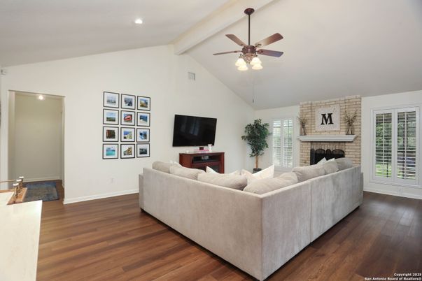 Fireplace, Interior, Living room, Recessed Lighting, Stone Walls, Wood Texture Flooring