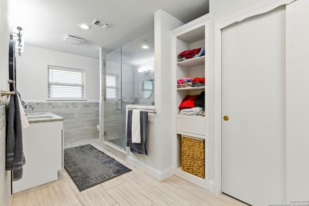 Bathroom, Glass Shower, Interior, Recessed Lighting, Walk-in Closets, Wood Texture Flooring