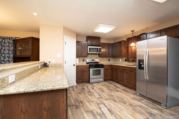 Interior, Kitchen, Pendant Lights, Recessed Lighting, Stainless Steel Appliances, Wood Texture Flooring