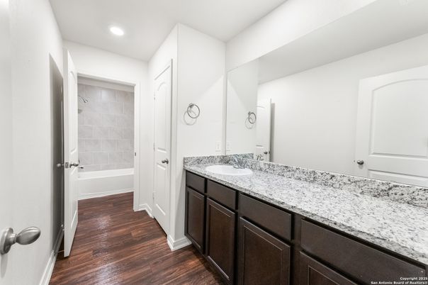 Bathroom, Dual Sink Vanities, Interior, Recessed Lighting, Wood Texture Flooring