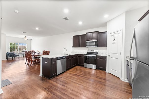 Dining room, Interior, Kitchen, Recessed Lighting, Stainless Steel Appliances, Wood Texture Flooring