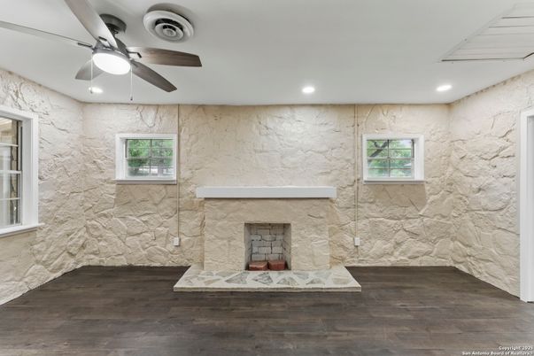 Fireplace, Interior, Marble Walls, Recessed Lighting, Stone Walls, Wood Texture Flooring