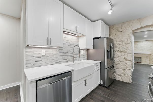 Interior, Kitchen, Marble Walls, Recessed Lighting, Stainless Steel Appliances, Wood Texture Flooring