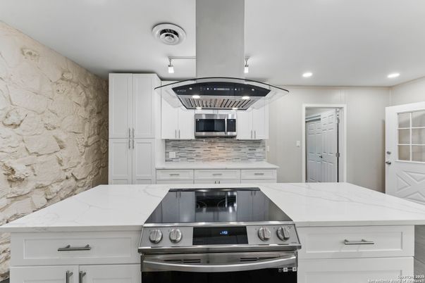 Interior, Kitchen, Recessed Lighting, Stainless Steel Appliances, Stone Walls