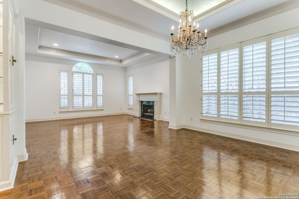 Chandelier, Empty room, Fireplace, Interior, Recessed Lighting, Wood Texture Flooring