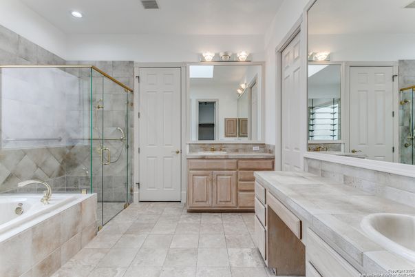 Bathroom, Dual Sink Vanities, Glass Shower, Interior, Recessed Lighting, Tile Countertops