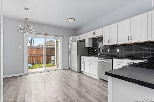 Chandelier, Interior, Kitchen, Pendant Lights, Stainless Steel Appliances, Wood Texture Flooring
