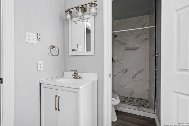 Bathroom, Glass Shower, Interior, Marble Walls, Wood Texture Flooring