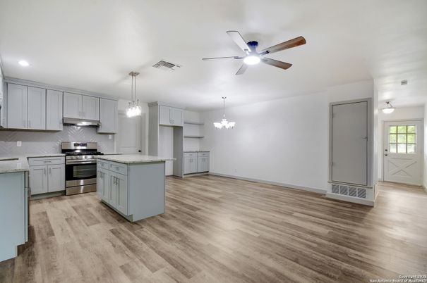 Chandelier, Interior, Kitchen, Pendant Lights, Recessed Lighting, Stainless Steel Appliances, Wood Texture Flooring