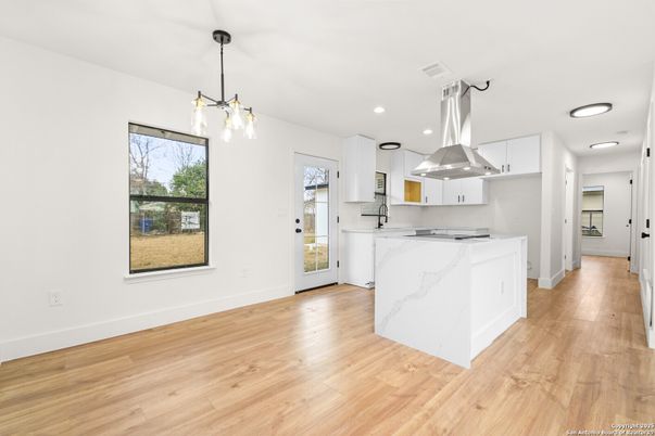 Interior, Kitchen, Marble Walls, Pendant Lights, Recessed Lighting, Wood Texture Flooring
