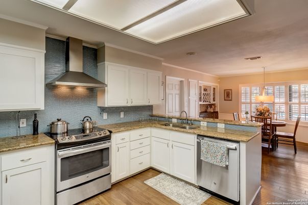 Dining room, Interior, Kitchen, Pendant Lights, Stainless Steel Appliances, Wood Texture Flooring