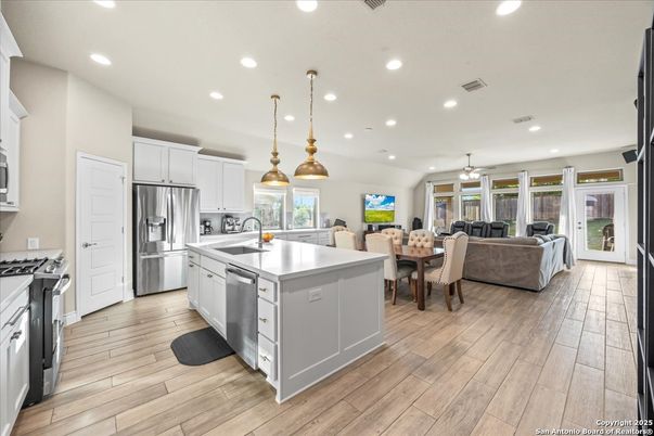 Dining room, Interior, Kitchen, Living room, Pendant Lights, Recessed Lighting, Stainless Steel Appliances, Wood Texture Flooring