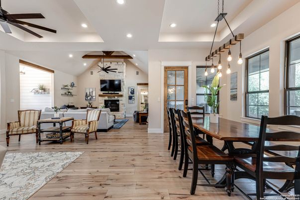 Dining room, Fireplace, Interior, Living room, Pendant Lights, Recessed Lighting, Wood Texture Flooring