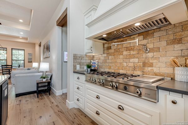Interior, Kitchen, Living room, Recessed Lighting, Stainless Steel Appliances, Stone Walls, Wood Texture Flooring