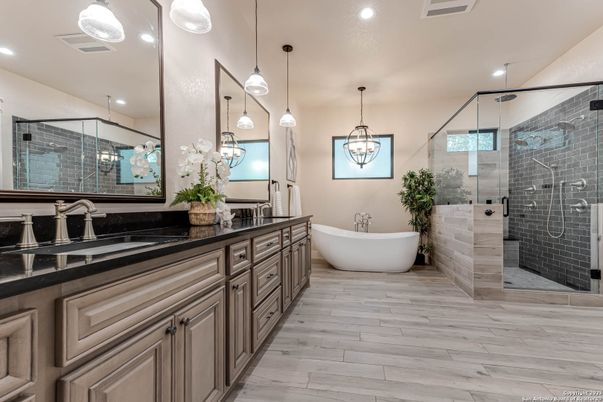 Bathroom, Dual Sink Vanities, Free Standing Baths, Glass Shower, Interior, Pendant Lights, Recessed Lighting, Wood Texture Flooring