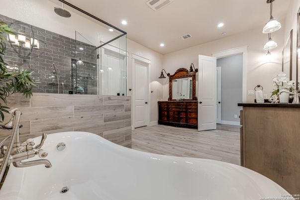 Bathroom, Dual Sink Vanities, Glass Shower, Interior, Pendant Lights, Recessed Lighting, Wood Texture Flooring